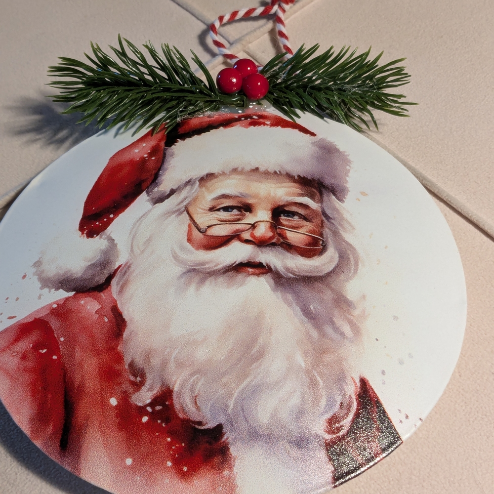 Festive Old World Santa Claus Metal Ornament With Greenery.